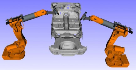 Motion-planned robots carrying out stud welds.